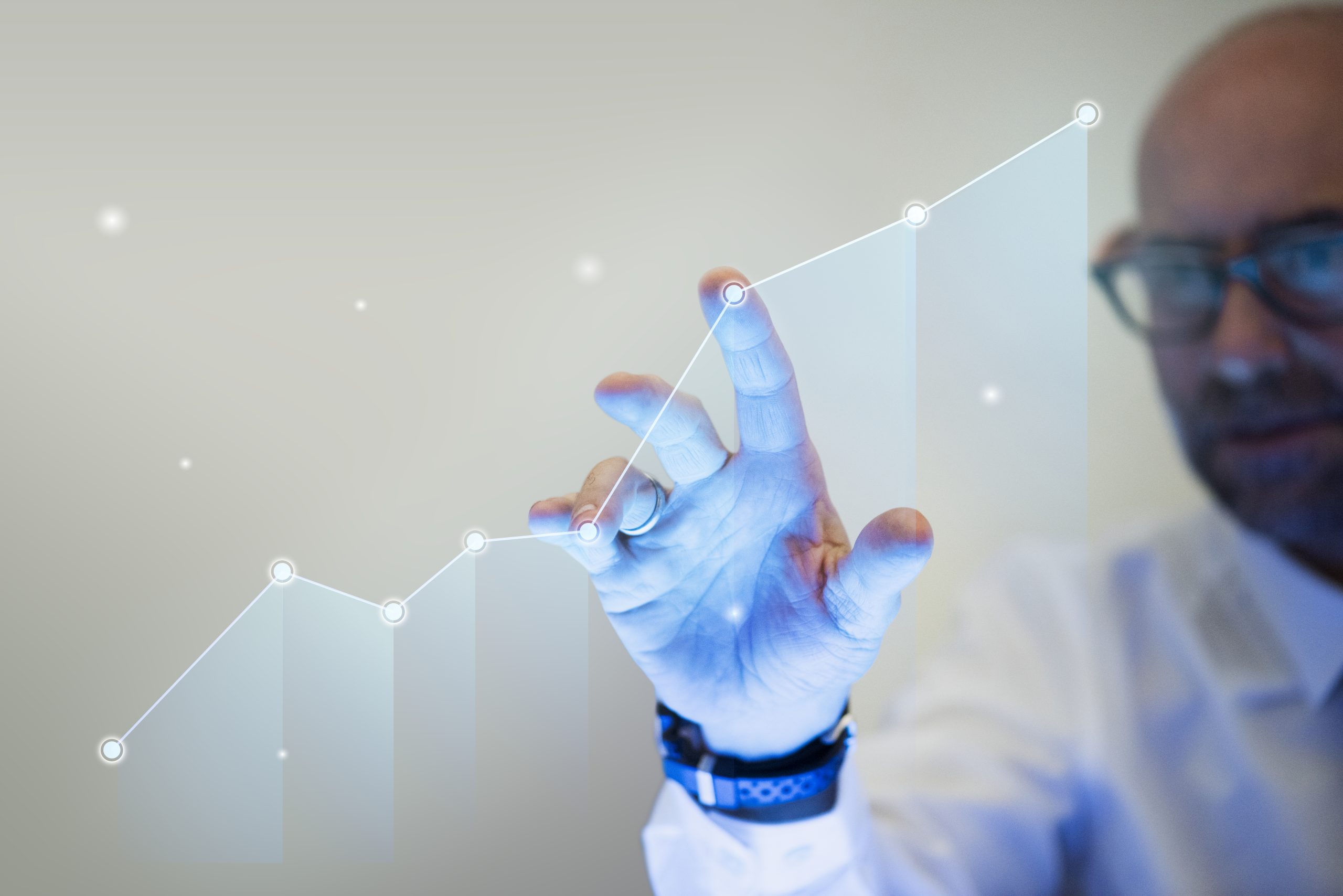 businessman-pointing-his-finger-growth-graph-scaled